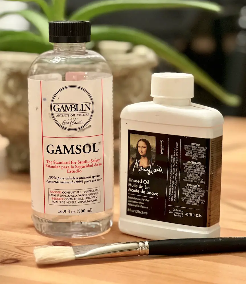 Photo of a bottle of Gamblin Gamsol odorless mineral spirit and a bottle of Speedball Linseed oil