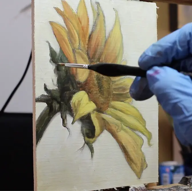 painting edges of stem on sunflower painting